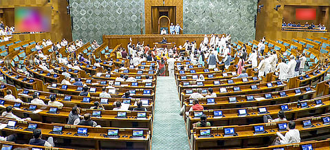 Opposition MPs protest in Lok Sabha during the Monsoon Session of Parliament in New Delhi on Tuesday, Aug. 5, 2025.