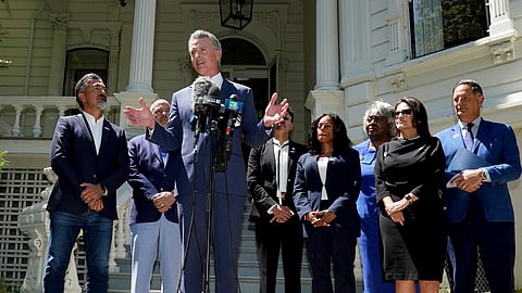 California Gov. Gavin Newsom, accompanied by several members of the Texas State Legislature, calls for a new way for California to redraw its voting districts during a news conference In Sacramento, Calif., Friday, July 25, 2025.