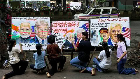 Students from the Gurukul School of Art complete artworks of US President Donald Trump and Prime Minister of India Narendra Modi in Mumbai, India, Friday, Aug. 1, 2025.