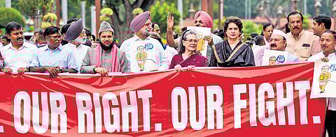Congress MPs Sonia Gandhi and Priyanka Gandhi Vadra with other MPs of the INDIA bloc parties stage a protest against SIR in Bihar during the Monsoon session of Parliament, on Tuesday.