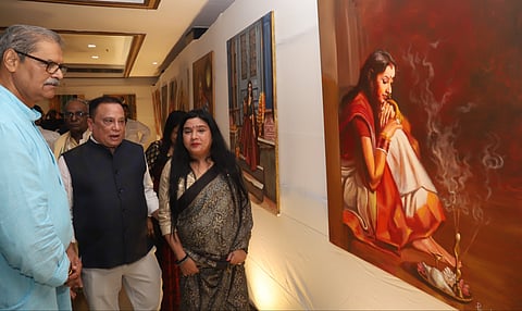 Deputy Chief Minister KV Singhdeo going round at the solo art exhibition Desh by artist Pranati Das at Bhubaneswar Cub in Bhubaneswar on Monday
