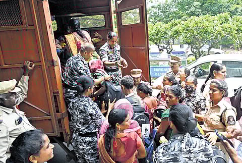 Midday meal workers being taken into custody by police at the office of Commissioner & Directorate Of School Education in Hyderabad on Wednesday.