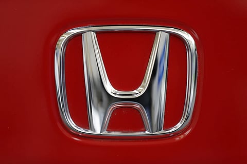 The photo shows a Honda logo on the trunk of a Honda automobile at the Pittsburgh Auto Show, in Pittsburgh, Feb 14, 2013.