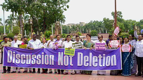 Parliamentarians from the INDIA bloc parties at a protest against the Election Commission's Special Intensive Revision (SIR) of electoral rolls in Bihar, during the Monsoon session of Parliament, in New Delhi, Wednesday, Aug. 6, 2025.