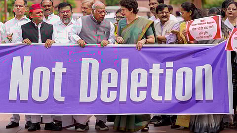 File Image | Leader of Opposition in the Rajya Sabha Mallikarjun Kharge, Congress MP Priyanka Gandhi Vadra, Samajwadi Party MP Akhilesh Yadav, Shiv Sena (UBT) MP Sanjay Raut, NCP-SP MP Supriya Sule and other parliamentarians from the INDIA bloc parties at a protest against the Election Commission's Special Intensive Revision (SIR) of electoral rolls in Bihar, during the Monsoon session of Parliament, in New Delhi, Wednesday, Aug. 6, 2025.