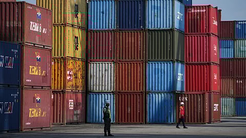 A crane unloads a shipping container from a truck at IPC Container Terminal at Tanjung Priok Port in Jakarta, Indonesia.