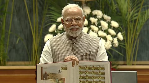Prime Minister Narendra Modi releases a centenary memorial stamp during the M.S. Swaminathan Centenary International Conference, in New Delhi, Thursday, Aug. 7, 2025.