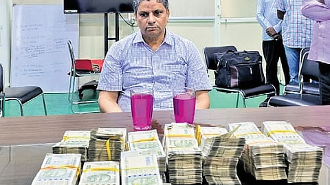 ACB officials nab Tribal Welfare Department ENC Srinivas red handed while accepting RS 25 lakh
