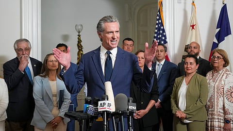 Accompanied by California and Texas lawmakers, California Gov. Gavin Newsom, center, discusses the push to schedule a special election to redraw California's Congressional voting districts during a news conference in Sacramento, Calif., Friday Aug. 8, 2025.