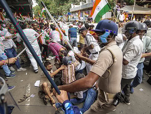 BJP members and security personnel clash during a protest organised to mark the completion of one year of the rape and murder of a trainee doctor at RG Kar hospital, in Kolkata, West Bengal, Saturday, Aug. 9, 2025.