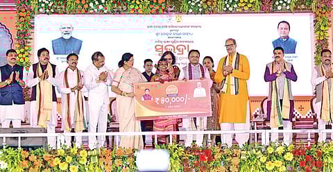 Chief Minister Mohan Charan Majhi releasing the third installment of Subhadra money to beneficiaries at a function at Jeypore, in Koraput district.