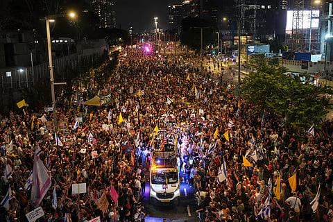 Relatives and supporters of Israeli hostages held in the Gaza Strip attend a rally demanding their release from Hamas captivity and calling for an end to the war, in Tel Aviv, Israel, Saturday, Aug. 9, 2025.