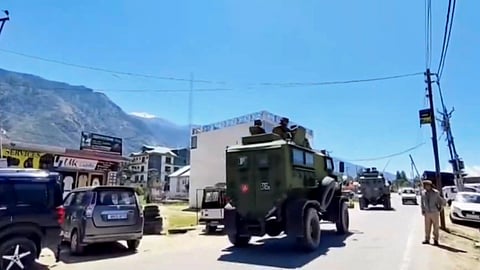 Security personnel patrol the area after an encounter broke out between terrorists and security forces in Kishtwar
