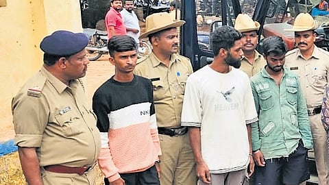 Police take husband Manjunath (in green shirt) into custody in Hosapete.