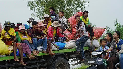 Cambodians sit on a cart of a tractor as they take refuge in Oddar Meanchey province, Cambodia.