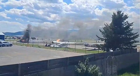In this image made from video provided by Ron Danielson, a plane crashes into a parked aircraft at Kalispell City Airport, triggering a large fire, in Kalispell, Mont., Monday, Aug. 11, 2025.