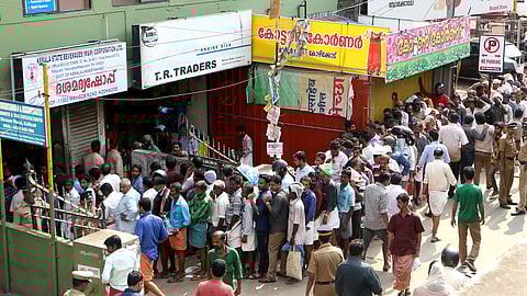 Customers queue up in front of a Bevco outlet in Kerala | File Pic