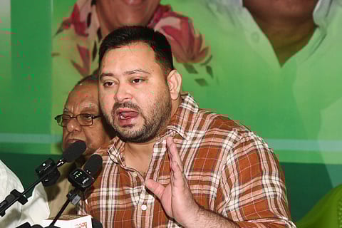 LoP in the Bihar Assembly and RJD leader Tejashwi Yadav addresses a press conference, in Patna, Wednesday, Aug. 13, 2025.