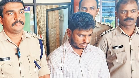 Police team with the accused Karthikraj at the Thodupuzha police station on Wednesday.