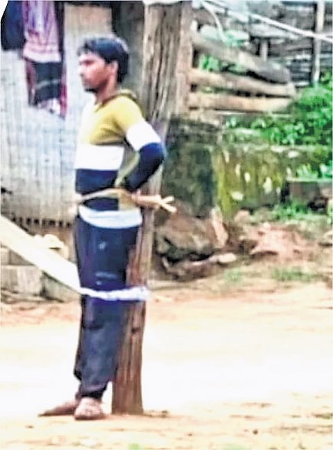 26-year-old youth tied to a pole in Garadama village of Gajapati district.
