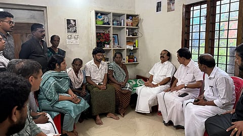 Union Minister George Kurian with Sona’s family at their residence in Karukadom, Kothamangalam, on Wednesday