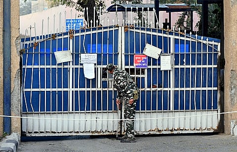 A security guard stands outside the Tihar Jail premises in New Delhi.