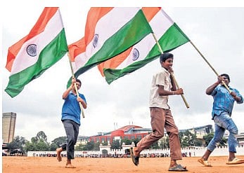 School boys wave the Tricolour and rehearse for Independence Day, which will be celebrated on Field Marshal Sam Manekshaw Parade Ground on Friday