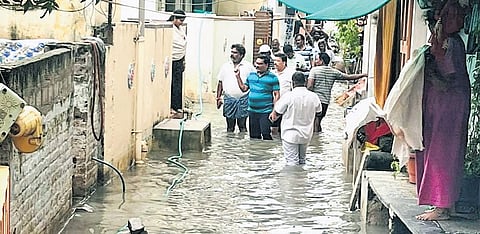 GMC Commissioner Puli Srinivasulu inspecting rain-inundated areas.