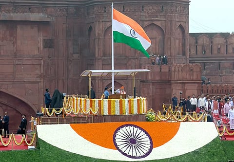 Prime Minister Narendra Modi stands for the national anthem after hoisting the national flag during the 79th Independence Day celebration at the Red Fort, in New Delhi, Friday, Aug. 15, 2025.