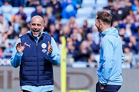 Manchester City manager Pep Guardiola and assistant coach Pep Lijnders during a training session at the City Football Academy, Manchester, England, Tuesday, Aug. 5, 2025.