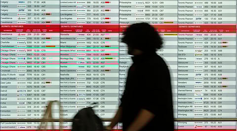 Cancelled and delayed Air Canada flights are seen on the departure board at Montreal-Pierre Elliott Trudeau International Airport in Dorval, Que., Friday, Aug. 15, 2025.