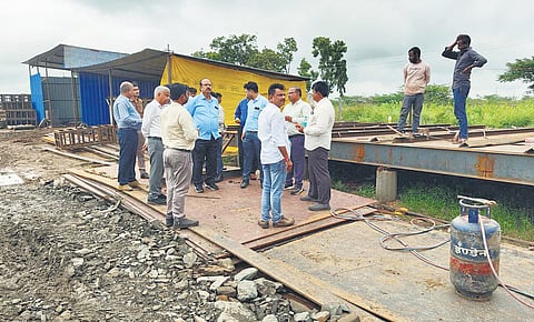 An expert team inspects the crest gate no 19 installation work of TB Dam.
