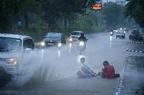 Kids enjoying rain at Janpath as a fresh low-pressure area formed over Bay of Bengal trigger incessant rain in Bhubaneswar.