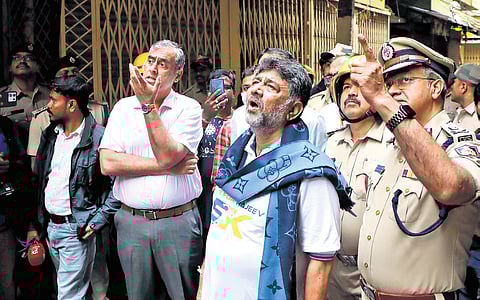 Deputy Chief Minister DK Shivakumar, City Police Commissioner Seemanth Kumar Singh, BBMP Commissioner Maheshwar Rao inspect the plastic manufacturing unit, where the fire broke out, in Nagarathpete, Bengaluru, on Sunday.