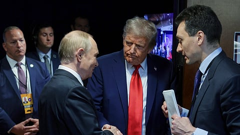 US President Donald Trump, second right, shakes hands with Russian President Vladimir Putin after their joint news conference on Friday, Aug. 15, 2025, at Joint Base Elmendorf-Richardson, Alaska.