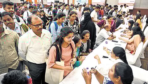 Students and their parents at the International Foreign Education Fair in Bengaluru on Sunday.