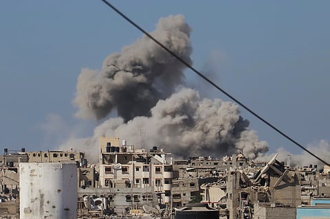 Smoke rises to the sky following an Israeli army airstrike in Khan Younis, in the Gaza Strip, Monday, Aug. 18, 2025.
