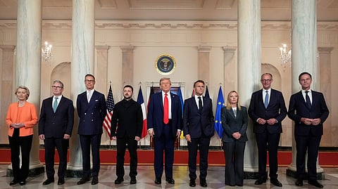 (From L to R) European Commission President Ursula von der Leyen, British Prime Minister Keir Starmer, Finland's President Alexander Stubb, Ukrainian President Volodymyr Zelenskyy, US President Donald Trump, France's President Emmanuel Macron, Italy's Prime Minister Giorgia Meloni, Germany's Chancellor Friedrich Merz and NATO Secretary General Mark Rutte pose for a group photo in the Grand Foyer of the White House, Monday, Aug. 18, 2025, in Washington.
