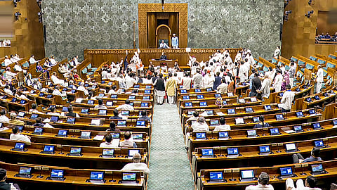 Opposition Members protest in the Lok Sabha during the Monsoon session of Parliament, in New Delhi, Monday, Aug. 18, 2025.