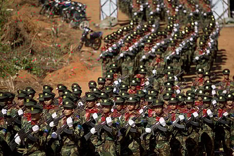 Ta'ang National Liberation army officers march during a function to mark 52nd Ta'ang revolution day in Mar-Wong, Ta'ang self-governing area, northern Shan state, Myanmar, Jan. 12, 2015.