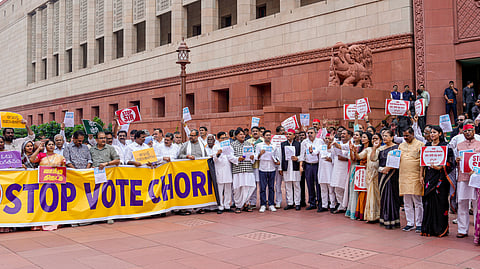 Opposition MPs stage a protest against the Election Commission's Special Intensive Revision (SIR) of electoral rolls in Bihar, during the Monsoon session of Parliament.