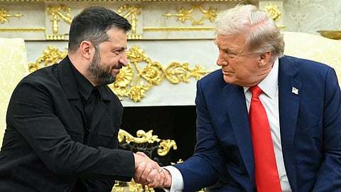 Ukrainian President Volodymyr Zelensky and US President Donald Trump shake hands during a meeting in the Oval Office of the White House in Washington, DC, on August 18, 2025.