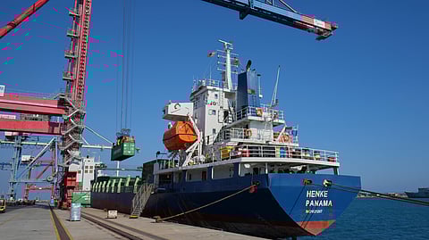 Containers loaded with humanitarian aid for the people of Gaza, including flour, pasta, baby food and canned goods, is being loaded aboard a Panamanian-flagged ship at Cyprus' main port in Limassol, on Monday, Aug. 18, 2025.