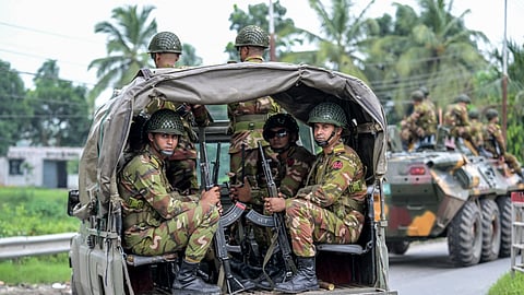 Bangladesh's army personnel patrol along a street in Gopalganj on July 17, 2025.