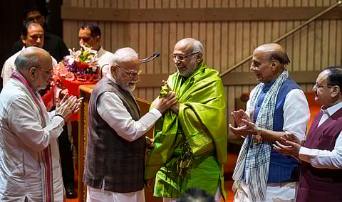 Prime Minister Narendra Modi felicitates Maharashtra Governor and NDA's vice presidential candidate C.P. Radhakrishnan as Defence Minister Rajnath Singh, Union Home Minister Amit Shah, and Union Minister and BJP National President J.P. Nadda applaud during the NDA parliamentary party meeting, in New Delhi, Tuesday, Aug. 19, 2025.