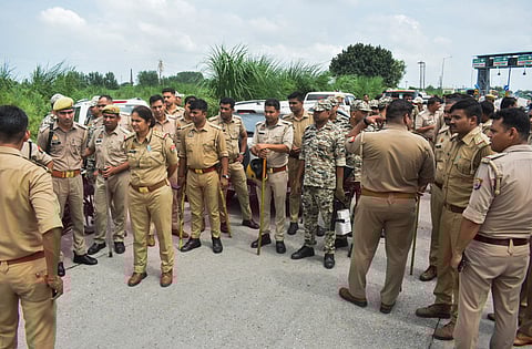 Meerut: Police personnel deployed after an Indian Army jawan was allegedly assaulted by Bhuni toll plaza employees, in Meerut district, Uttar Pradesh, Monday, Aug. 18, 2025.