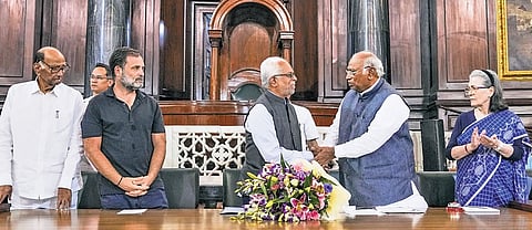 Congress chief Mallikarjun Kharge felicitates joint Opposition’s V-P candidate B Sudershan Reddy at the central hall of Samvidhan Sadan.