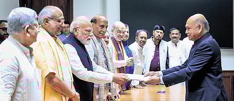 PM Modi with NDA’s vice presidential candidate CP Radhakrishnan and others, hands over four sets of nomination papers to the returning officer.