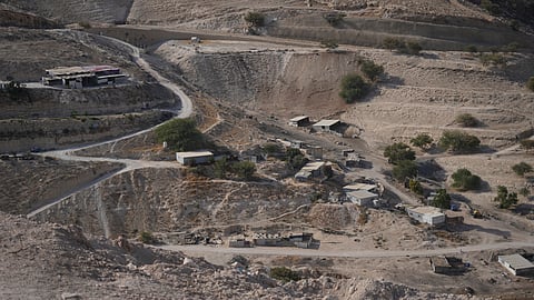 Palestinian hamlets are seen at the E1 area, an open tract of land east of Jerusalem, between the Israeli settlement of Maale Adumim and the occupied West Bank town of Eizariya Thursday, Aug. 14, 2025