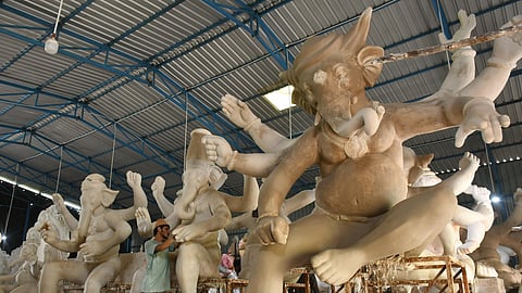 Workers making huge Ganesh idols in the Mumbai model ahead of Ganesh Chaturthi, at Nunna near Vijayawada.